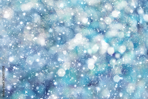 Abstract winter background. Snowflakes, snowfall, bokeh.