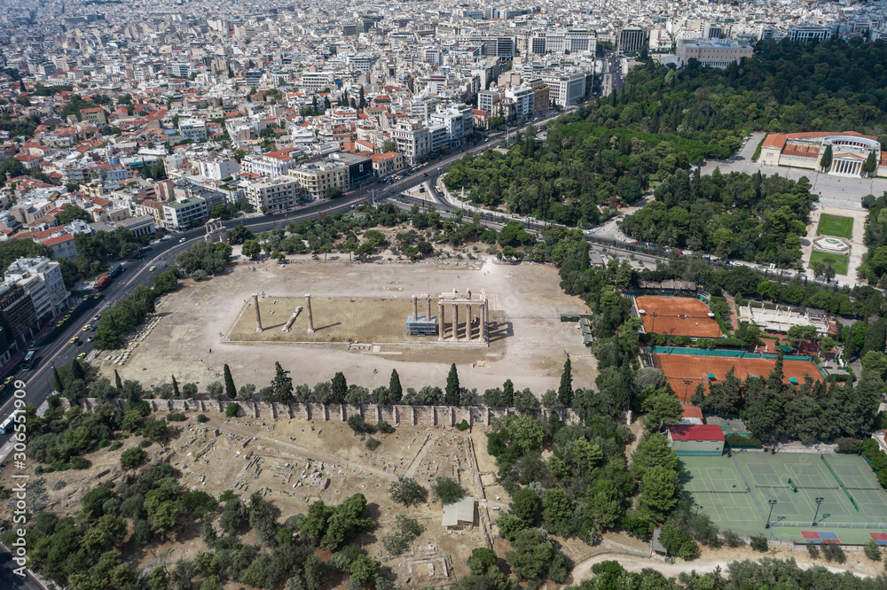 Aerial drone shot of temple ruins at Archaeological Site of Olympieion and zappeion hall in Athens