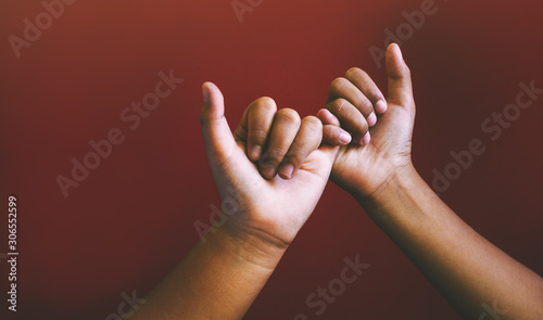 Cropped Hands Doing Pinky Promise photo