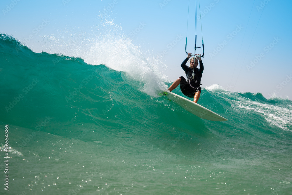 Obraz premium The kite surfer rides the waves of the Atlantic Ocean