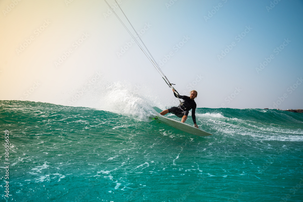 The kite surfer rides the waves of the Atlantic Ocean