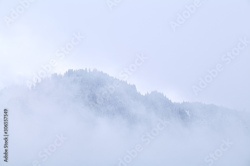 mountain top in dense winter fog