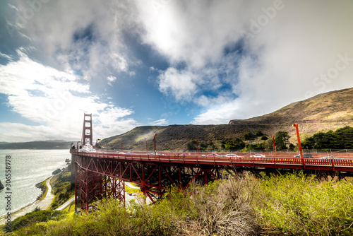 World famous Golden Gate bridge under a cloudy sky