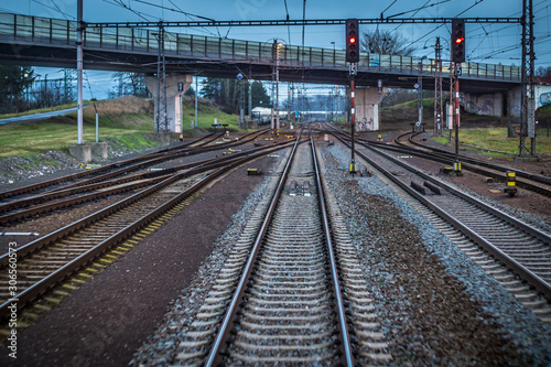 Train tracks fleeing into the distance as seen from the last carriage of the train