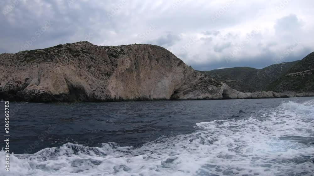 Blue Caves. Ionian sea. Beautiful seashore and mountains near Navagio, Zakynthos, Zante. Boat Trip in Greece Ionian islands. Nature. Blue grotto. Grotta Blue Caves. Ionian sea. Beautiful seashore and mountains near Navagio, Zakynthos, Zante. Boat Trip in Greece Ionian islands. Nature. Blue grotto. Grotta