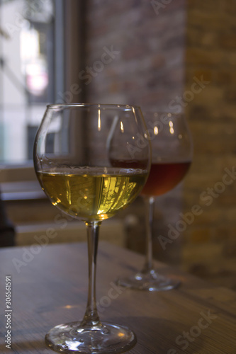 White and red wine in the glasses of a cafe