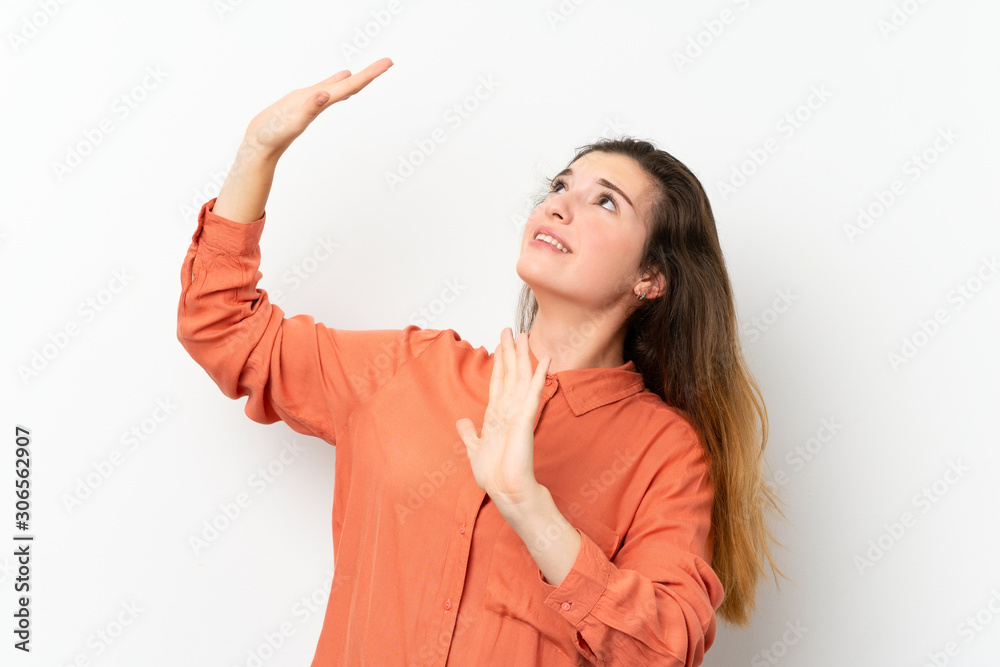 Young brunette girl over isolated white background nervous and scared Young brunette girl over isolated white background nervous and scared