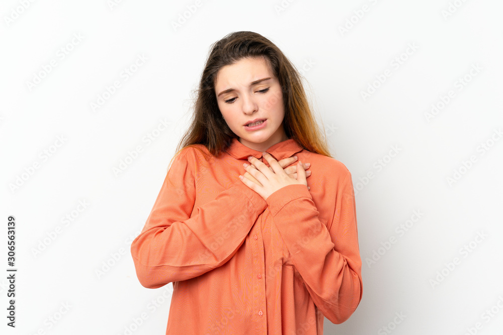Young brunette girl over isolated white background having a pain in the heart Young brunette girl over isolated white background having a pain in the heart