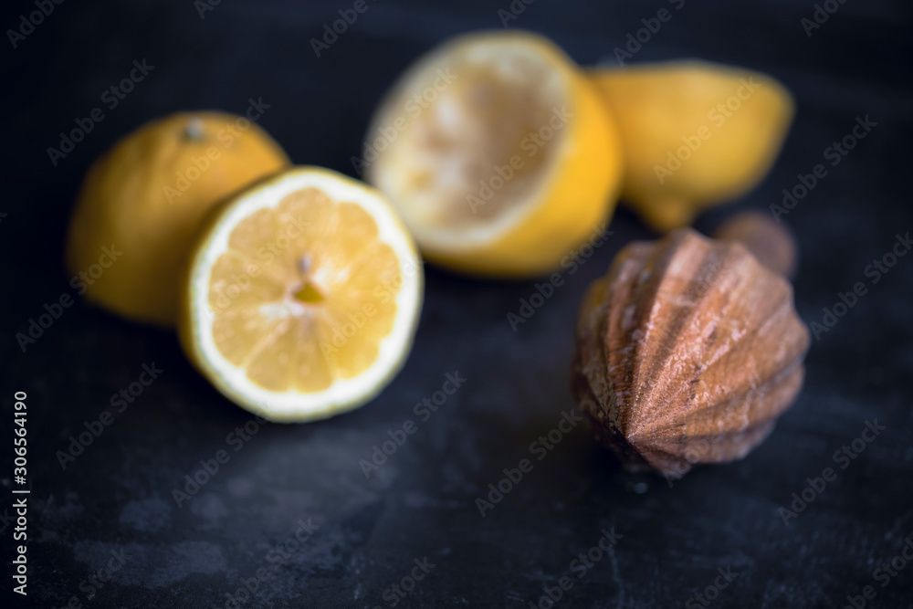 Wooden hand juicer and cut lemons Wooden hand juicer and cut lemons