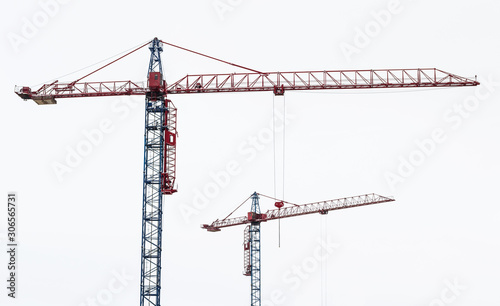 Obraz na płótnie Two tower cranes. Hoisting crane in white background