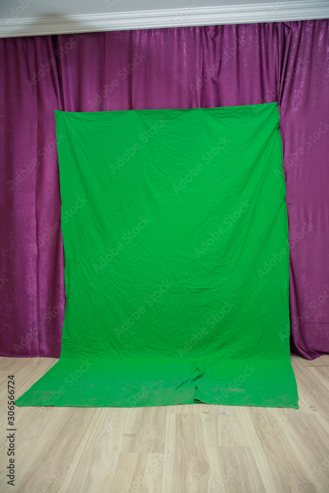 Big green background for added special effects in post production.Green