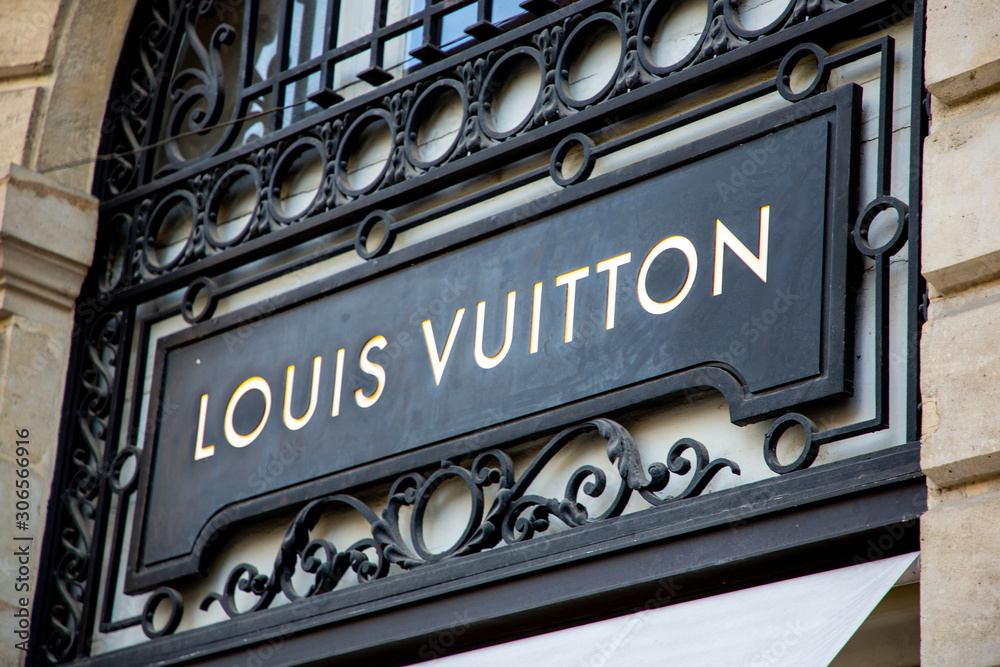 Louis Vuitton logo store sign Luxury brand shop handbags luggage