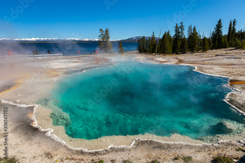 Blue geyser basin with smoke boiling in West Thumb geyser basin.