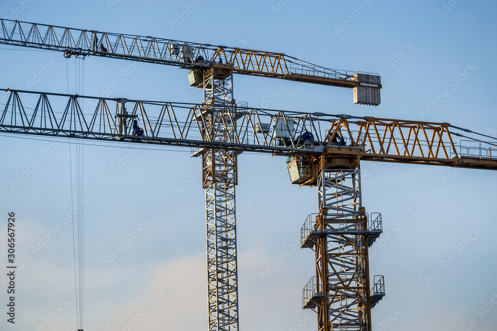 Two tower cranes. Hoisting crane
