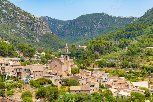 Amazing cityscape of Valldemossa Chopin village taken on a sunny summer day, Mallorca, Spain photo