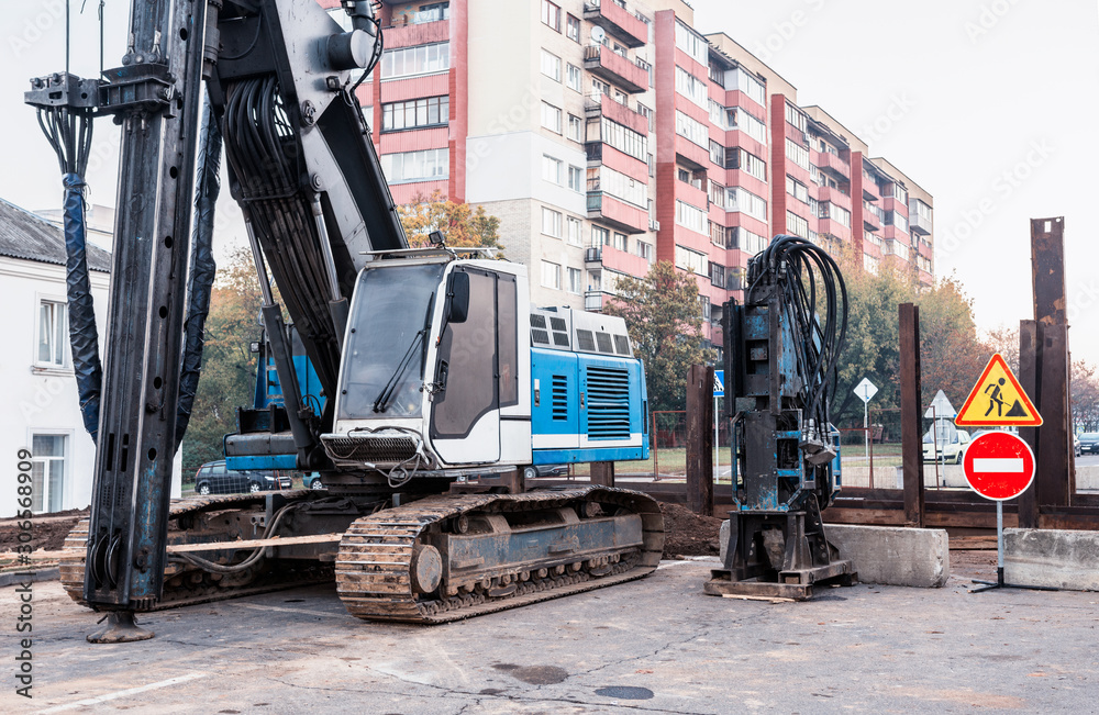 Fototapeta premium Big pile driver. Coper works on a city street