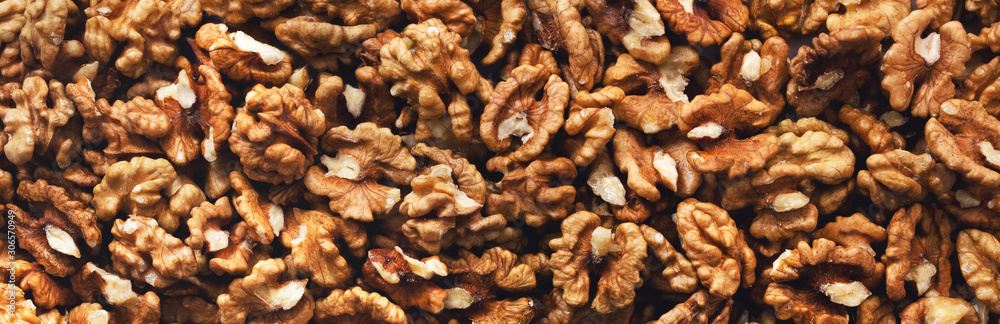 Peeled walnuts. Background. Texture. Panorama. Peeled walnuts. Background. Texture. Panorama.