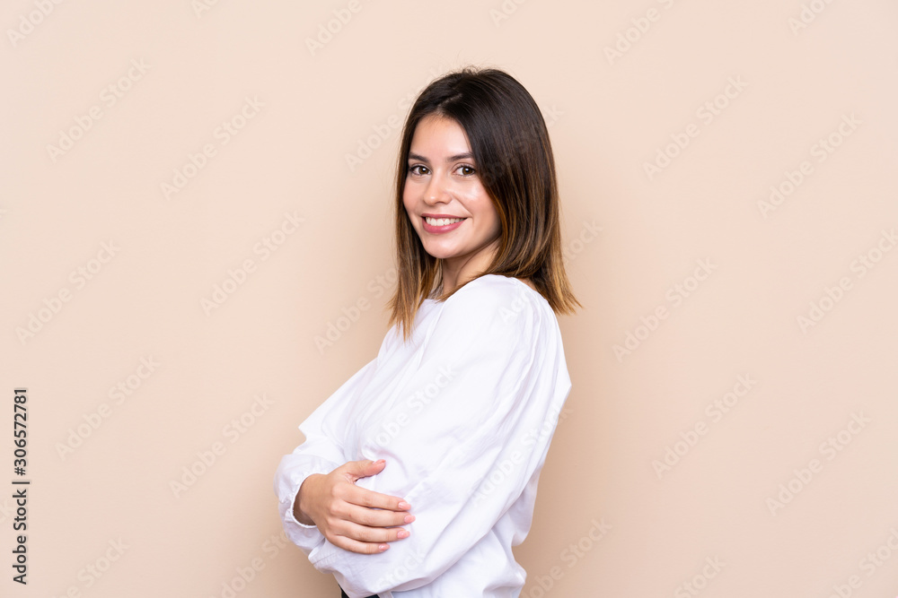 Young woman over isolated background laughing Young woman over isolated background laughing