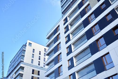 Fragment of modern residential apartment with flat buildings exterior. Detail of new luxury house and home complex. 