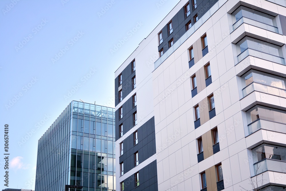 Fragment of modern residential apartment with flat buildings exterior. Detail of new luxury house and home complex. 