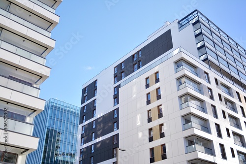 Fragment of modern residential apartment with flat buildings exterior. Detail of new luxury house and home complex. 