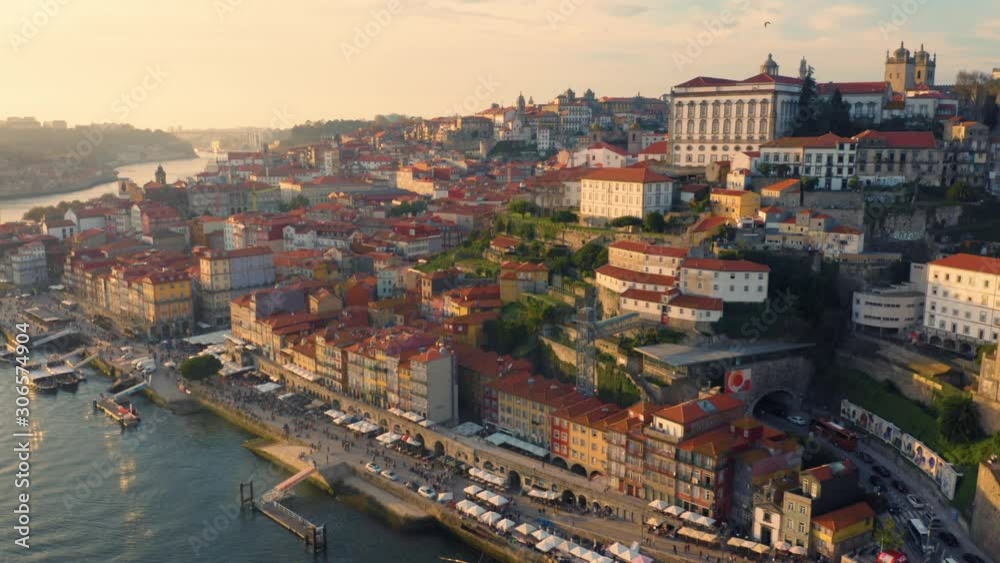 Porto, Portugal. Aerial view of the old city with promenade of the Douro river at sunset Porto, Portugal. Aerial view of the old city with promenade of the Douro river at sunset