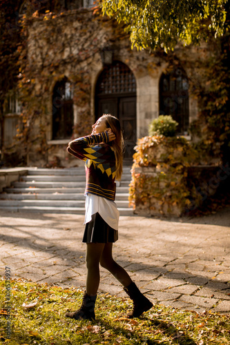Pretty young woman walking ...