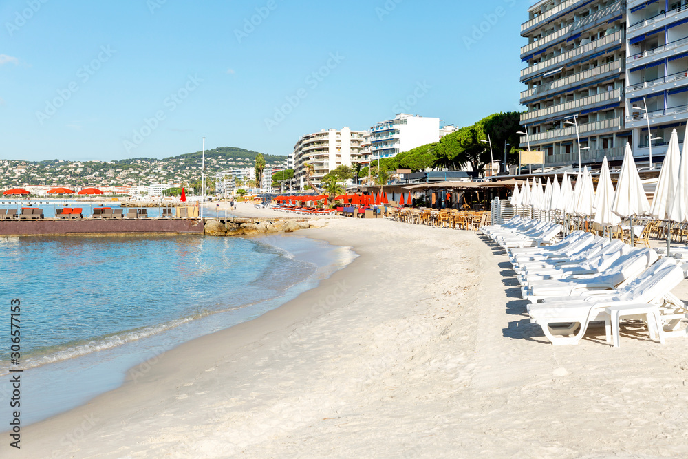 Luxurious resort area on the sandy seashore on the French Riviera. Beautiful landscape on a bright sunny day.