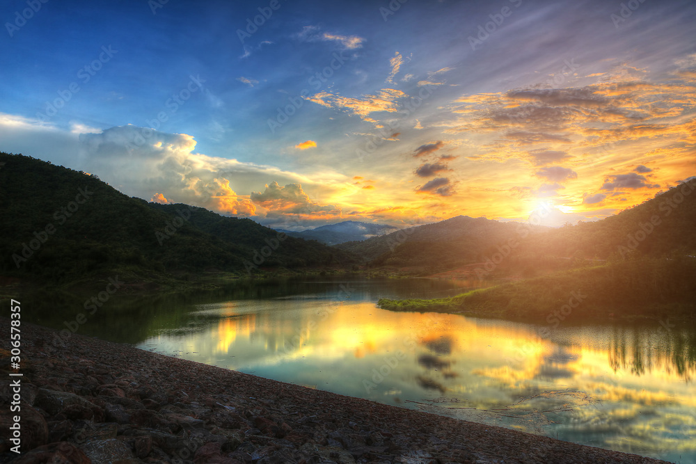 Stunning sunset above the rocky mountains. sunset mountains lake. Tourism Lake with sunset. lake sunset. landscape copy space.