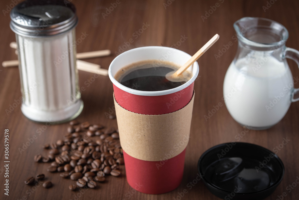 coffee in disposable paper cup with beans coffee in disposable paper cup with beans
