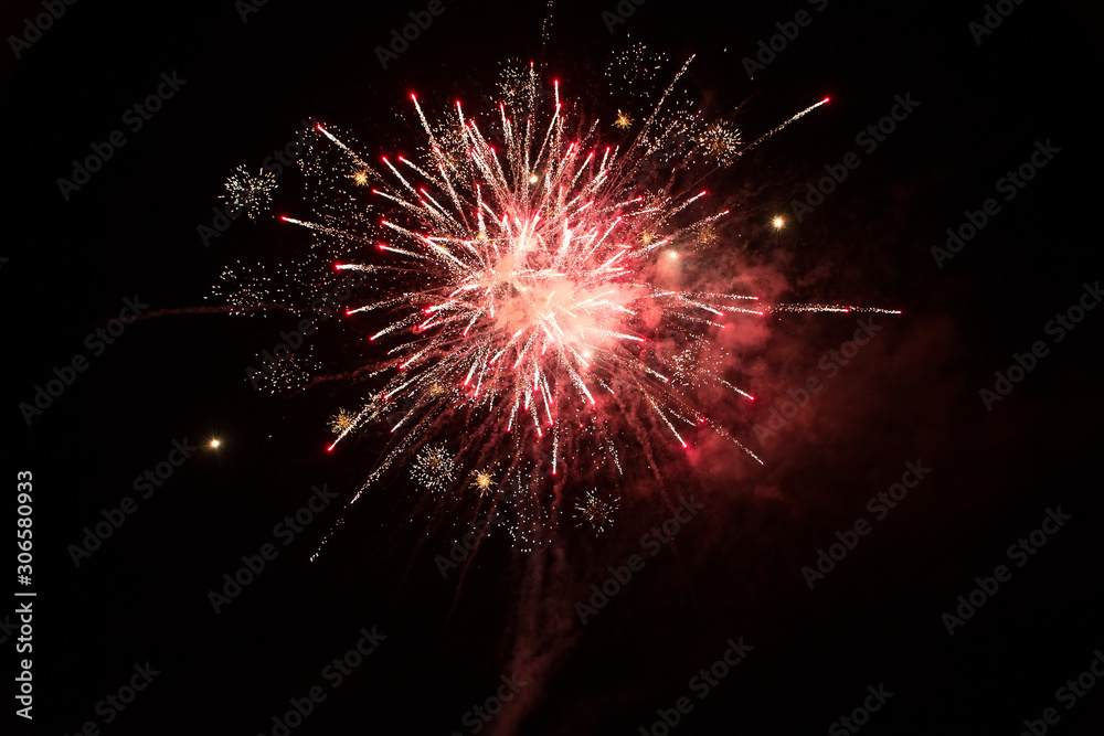 Beautiful red firework isolated on black background