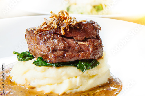 juicy steak beef meat and mashed potatoes