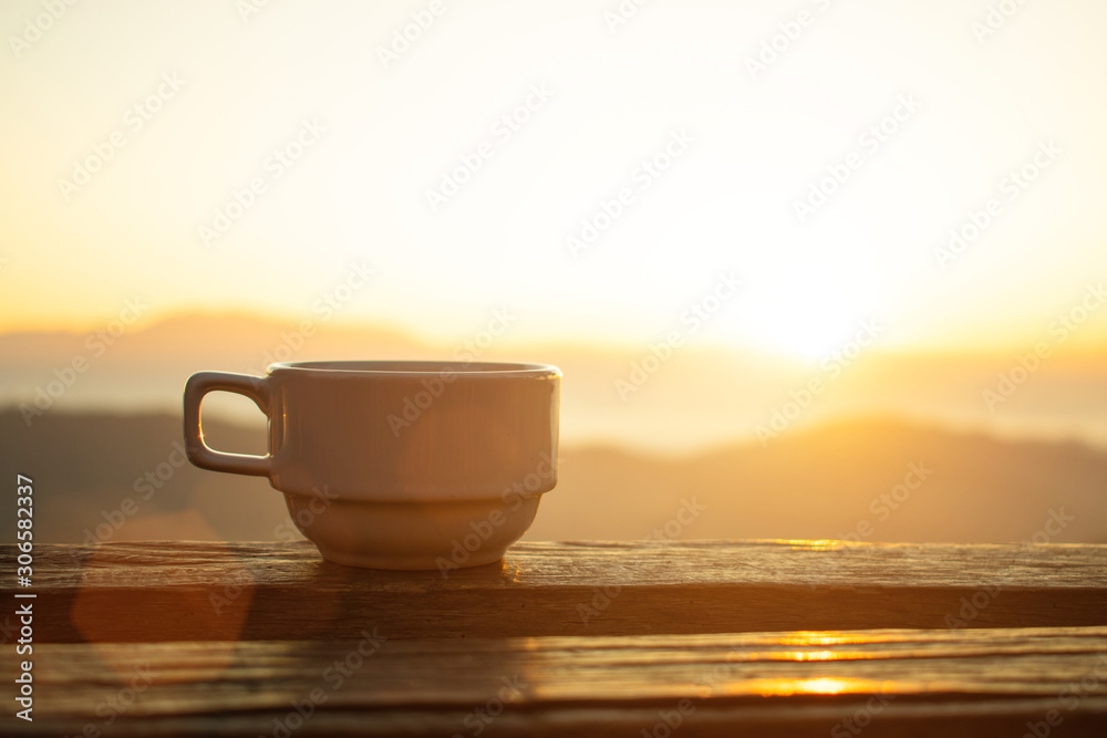 coffee cup and morning light with mountain view,selective focus