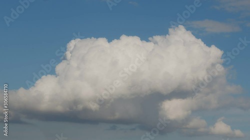 Moving Dramatic Single Cloud On A Blue Sky. Time Lapse photo