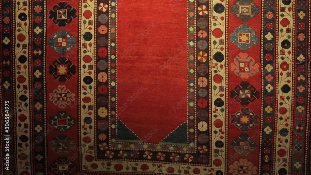 Large oriental rug with colorful patterns. Handmade rug production, carpet close-up with all the details