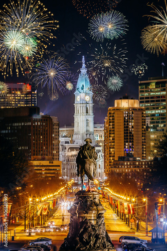 Colorful Fireworks  in Downtown Philadelphia, Pensilvania, USA. Cityscape celebrating New Years Eve with George Washington Statue in the middle. photo