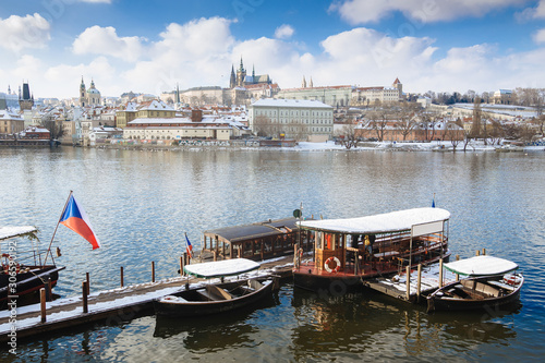 Fotografie Panorama on Prague Castle and river Vltava with local ferry serving as public tr