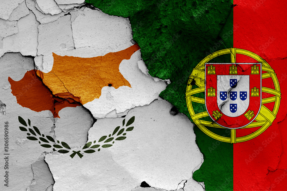 flags of Cyprus and Portugal painted on cracked wall