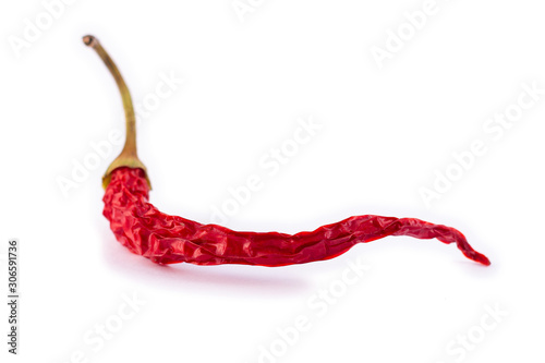 dry red hot peppers on white background