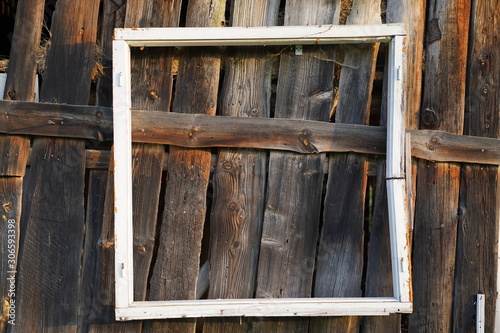 Old window frame hanging on a barn