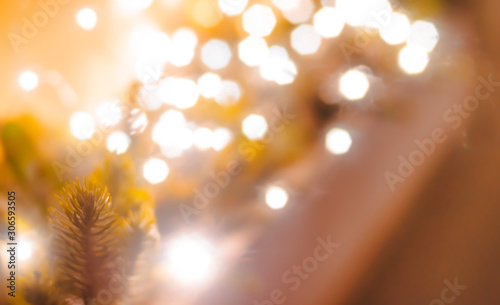 fur-tree branch with decorative lights bokeh defocused festive