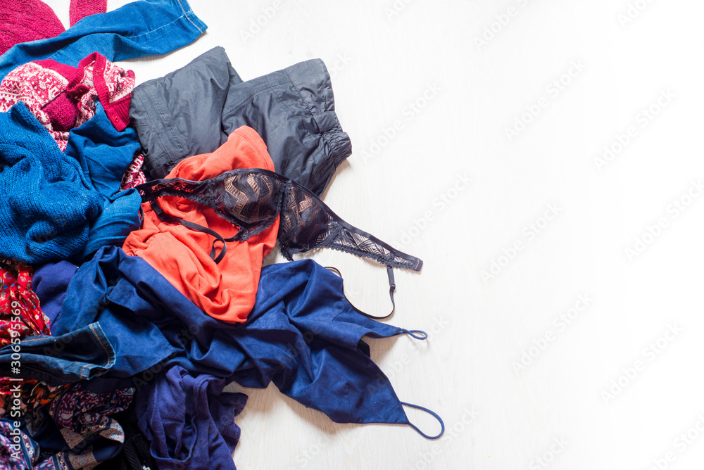 many scattered clothes on a white background. Place for text.Copyspace