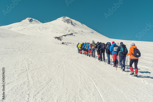 Climbing Elbrus group of climbers goes in the snow to the top