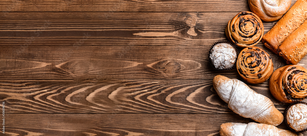 Tasty pastries on wooden background Tasty pastries on wooden background