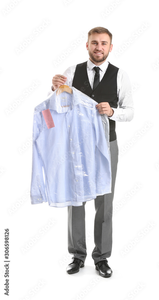 Male worker of modern dry-cleaner's with clothes on white background Male worker of modern dry-cleaner's with clothes on white background