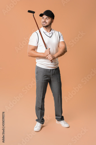Handsome male golfer on col...