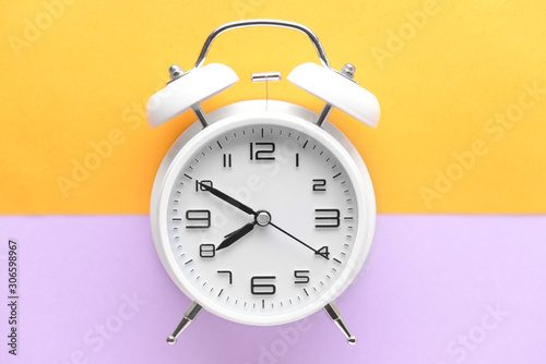 White alarm clock with blac...