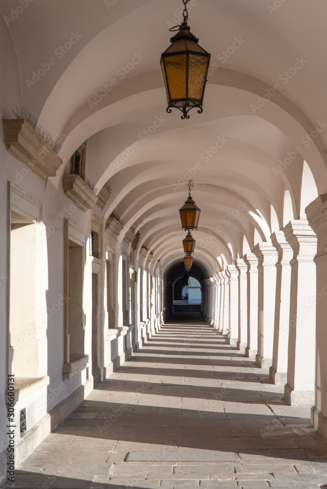 Old renaissance or mannerist arcades of tenement house in Zamosc, sunny day in Zamosc, touristic destinations in Poland, example of Lublin renaissance