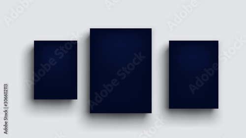 three dark blue boards on grey wall