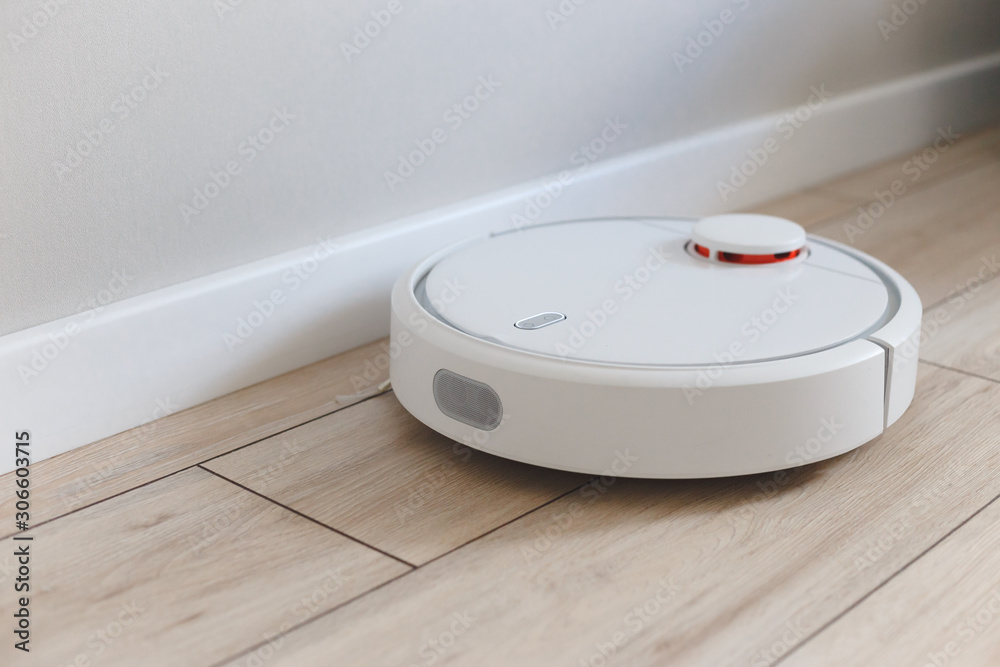 Home vacuum cleaning robot cleaning the room Home vacuum cleaning robot cleaning the room